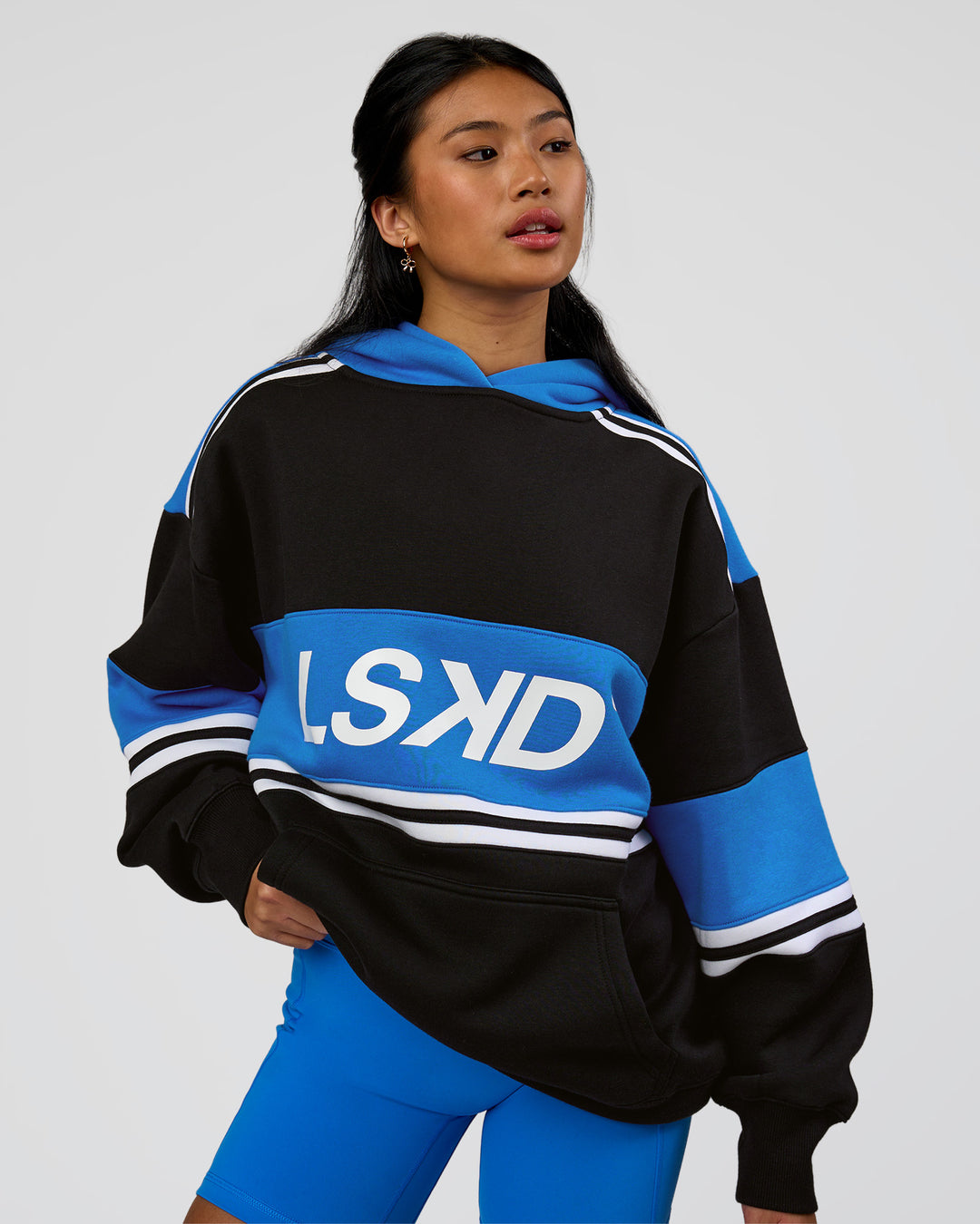 Woman wearing A-Team Oversized Hoodie - Caviar-Palace Blue | Model:Loren | Size:XS - view 14