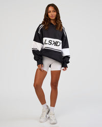 Woman wearing A-Team Oversized Hoodie - Caviar-White | Model:Dakota | Size:XS | Thumbnail Index: 4