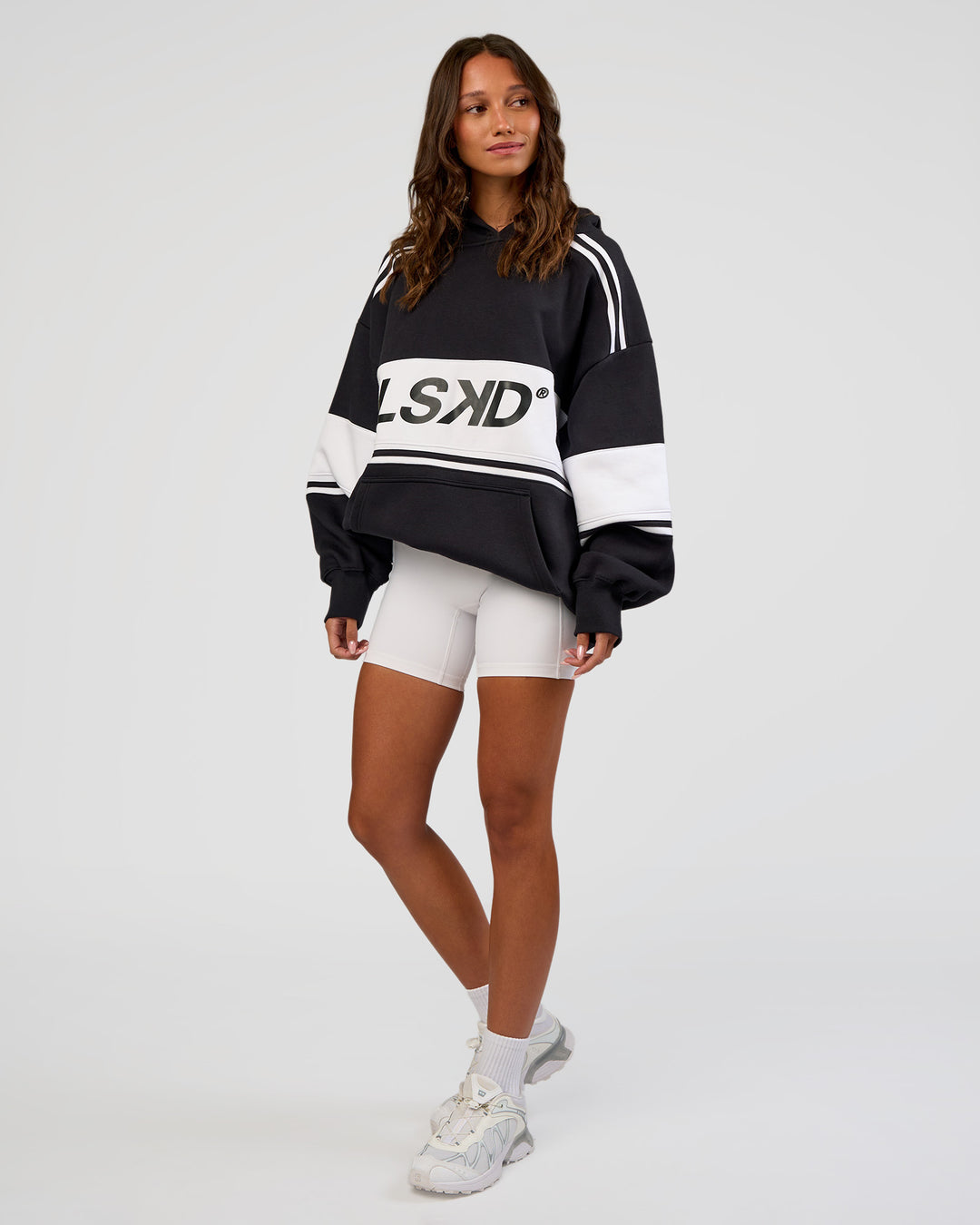 Woman wearing A-Team Oversized Hoodie - Caviar-White | Model:Dakota | Size:XS - view 11