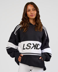 Woman wearing A-Team Oversized Hoodie - Caviar-White | Model:Dakota | Size:XS | Thumbnail Index: 3
