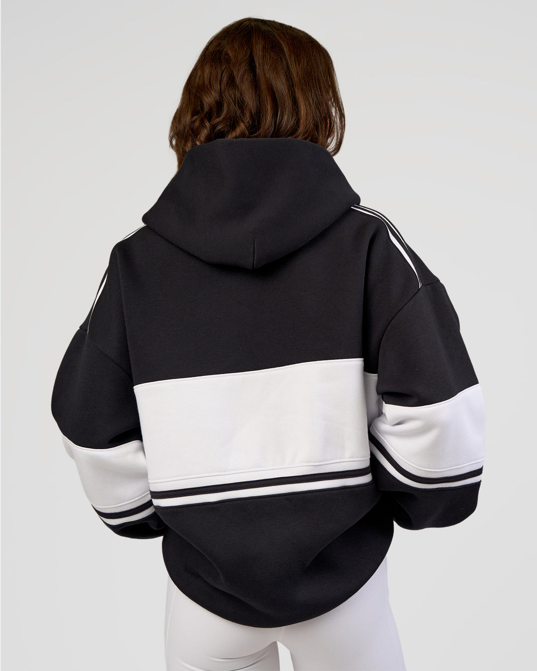 Woman wearing A-Team Oversized Hoodie - Caviar-White | Model:Dakota | Size:XS - view 8