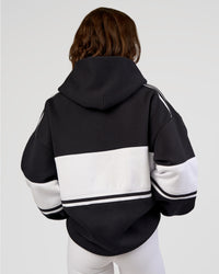 Woman wearing A-Team Oversized Hoodie - Caviar-White | Model:Dakota | Size:XS | Thumbnail Index: 7