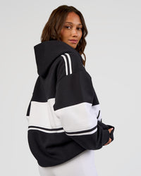 Woman wearing A-Team Oversized Hoodie - Caviar-White | Model:Dakota | Size:XS | Thumbnail Index: 11