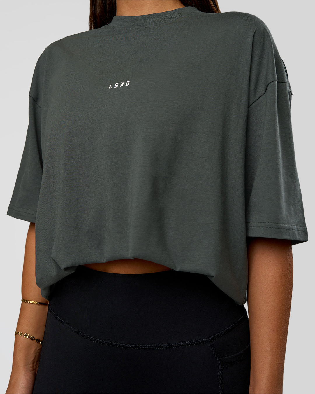 Woman wearing Abstract Haze FLXCotton Tee - Carbon Green-Cantaloupe | Model:Bianca | Size:XS - view 9