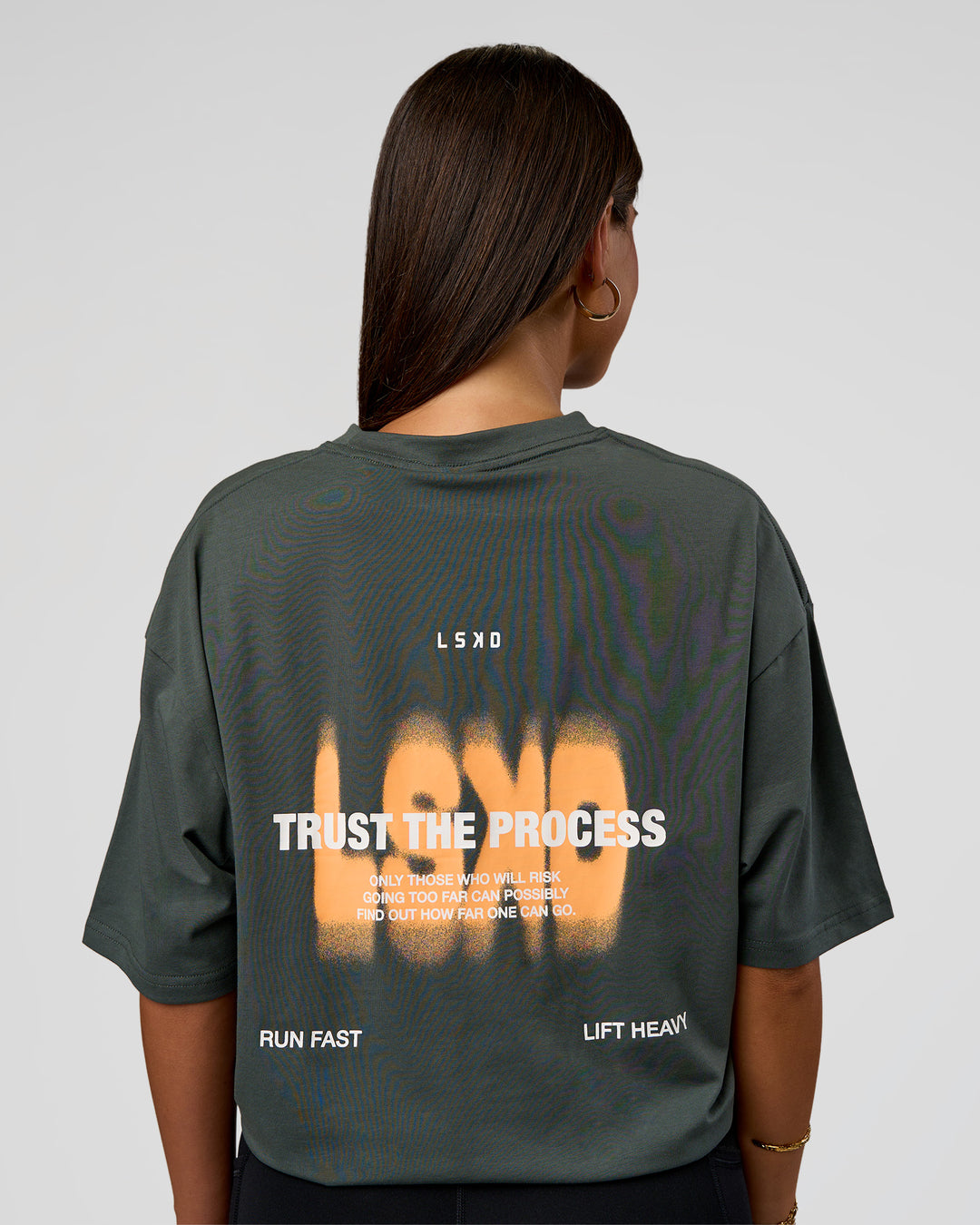 Woman wearing Abstract Haze FLXCotton Tee - Carbon Green-Cantaloupe | Model:Bianca | Size:XS - view 4