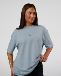 Woman wearing Abstract Haze FLXCotton Tee - Dusty Blue-Black | Model:Bianca | Size:XS | Thumbnail Index: 3