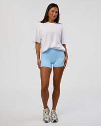Woman wearing Abstract Haze FLXCotton Tee - White-Blue Aura | Model:Bianca | Size:XS | Thumbnail Index: 6