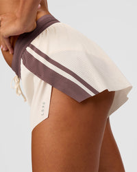 Woman wearing Accelerate 3" Force Mid-Rise Running Short - Cocoa powder-Off White | Model:Charli | Size:XS | Thumbnail Index: 5