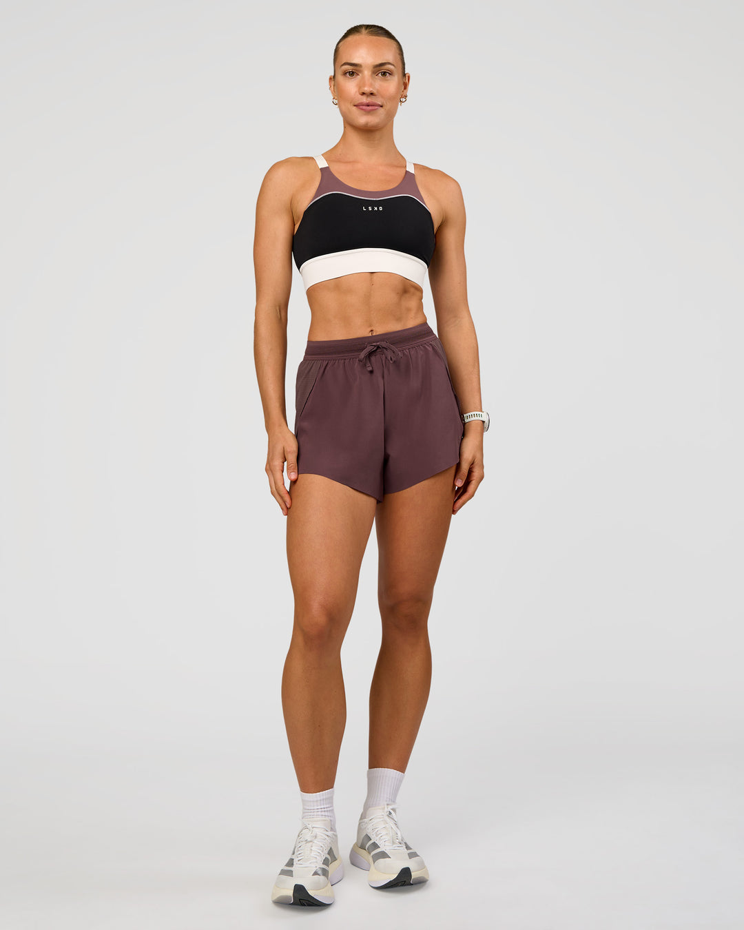 Woman wearing Accelerate 3" High-Rise Running Short - Cocoa Powder | Model:Maja | Size:XS - view 6