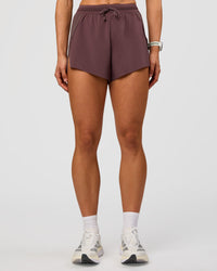 Woman wearing Accelerate 3" High-Rise Running Short - Cocoa Powder | Set:true | Angle:front | Model:Maja | Size:XS | Thumbnail Index: 6
