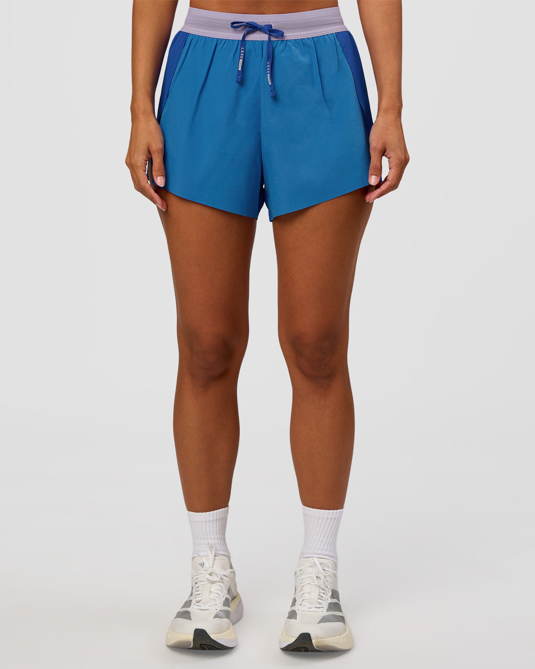 Woman wearing Accelerate 3" High-Rise Running Short - Electric Indigo-Multi | Set:true | Angle:front | Model:Brylee | Size:XS - view 7