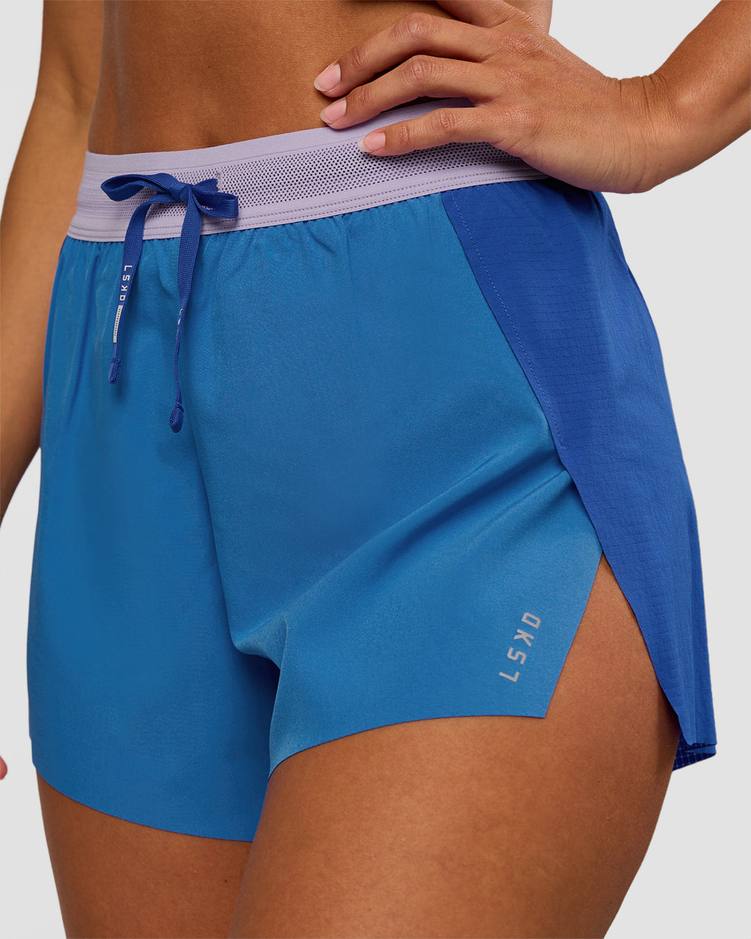 Woman wearing Accelerate 3" High-Rise Running Short - Electric Indigo-Multi | Set:true | Angle:closeup | Model:Brylee | Size:XS - view 5