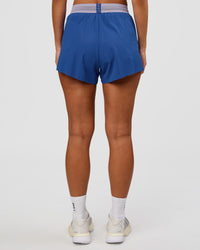 Woman wearing Accelerate 3" High-Rise Running Short - Electric Indigo-Multi | Set:true | Angle:back | Model:Brylee | Size:XS | Thumbnail Index: 3