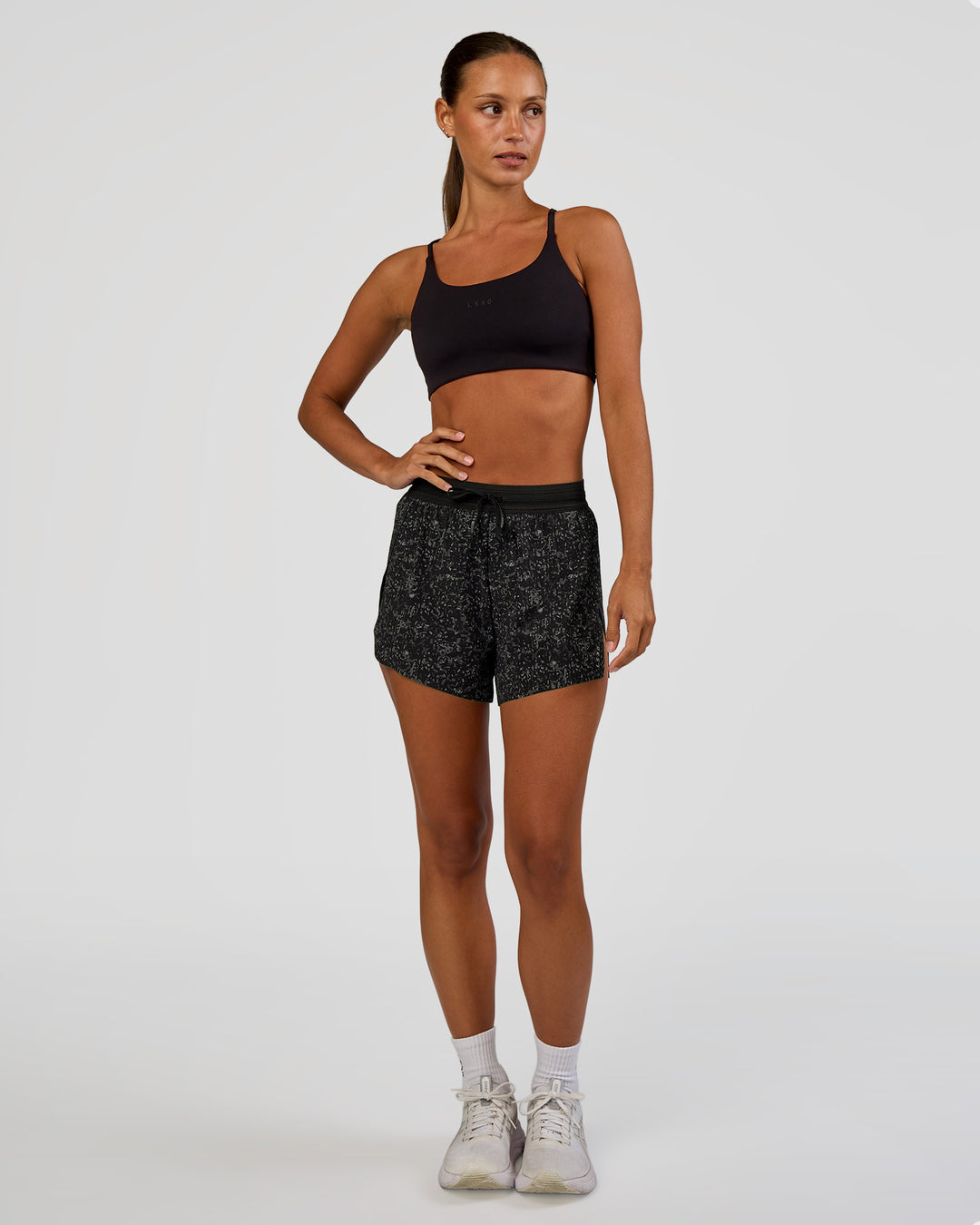 Woman wearing Accelerate 3" High-Rise Running Short - Energy Print Black | Model:Brylee | Size:XS - view 3