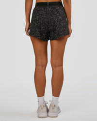 Woman wearing Accelerate 3" High-Rise Running Short - Energy Print Black | Set:true | Angle:back | Model:Brylee | Size:XS | Thumbnail Index: 4