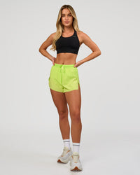 Woman wearing Accelerate 3" High-Rise Running Short in Hyper Green | Model:Issy | Sizze:XS | Thumbnail Index: 3