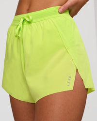 Woman wearing Accelerate 3" High-Rise Running Short in Hyper Green | Model:Issy | Sizze:XS | Thumbnail Index: 6