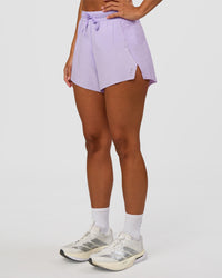 Woman wearing Accelerate 3" High-Rise Running Short - Pale Lilac | Set:true | Angle:side | Model:Brylee | Size:XS | Thumbnail Index: 6