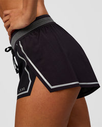 Woman wearing Accelerate 3" Reflective Mid-Rise Running Short - Black-Reflective | Model:Brylee | Size:XS | Thumbnail Index: 7