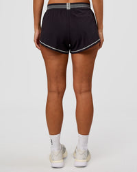 Woman wearing Accelerate 3" Reflective Mid-Rise Running Short - Black-Reflective | Set:true | Angle:back | Model:Brylee | Size:XS | Thumbnail Index: 3