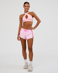 Woman wearing Accelerate 3" Mid-Rise Running Short - Candy Pink-Marshmallow | Model:Brylee | Size:XS | Thumbnail Index: 4