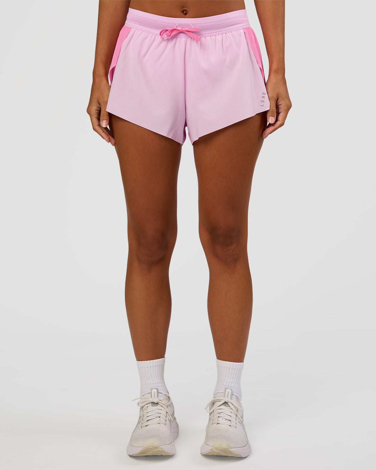 Woman wearing Accelerate 3" Mid-Rise Running Short - Candy Pink-Marshmallow | Set:true | Angle:front | Model:Brylee | Size:XS