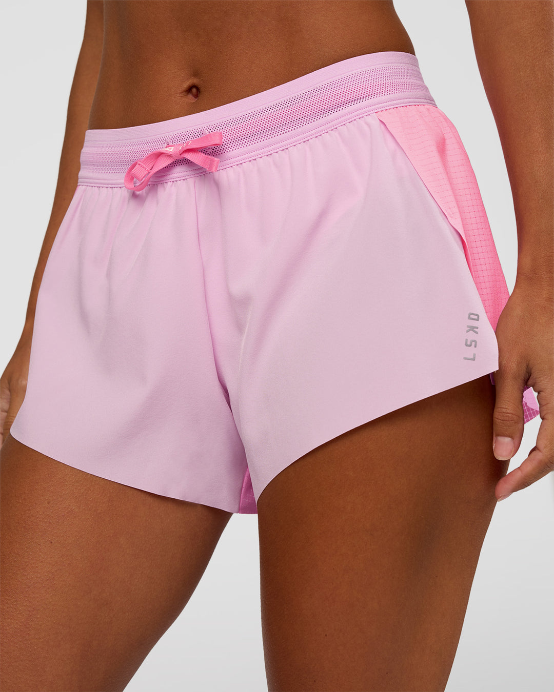 Woman wearing Accelerate 3" Mid-Rise Running Short - Candy Pink-Marshmallow | Model:Brylee | Size:XS - view 6