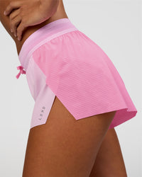 Woman wearing Accelerate 3" Mid-Rise Running Short - Candy Pink-Marshmallow | Set:true | Angle:closeup | Model:Brylee | Size:XS | Thumbnail Index: 2