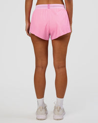 Woman wearing Accelerate 3" Mid-Rise Running Short - Candy Pink-Marshmallow | Set:true | Angle:back | Model:Brylee | Size:XS | Thumbnail Index: 3