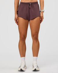 Woman wearing Accelerate 3" Mid-Rise Running Short - Cocoa Powder | Set:true | Angle:front | Model:Maja | Size:XS | Thumbnail Index: 5