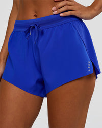 Woman wearing Accelerate 3" Mid-Rise Running Short - Electric Indigo | Set:true | Angle:closeup | Model:Brylee | Size:XS | Thumbnail Index: 3