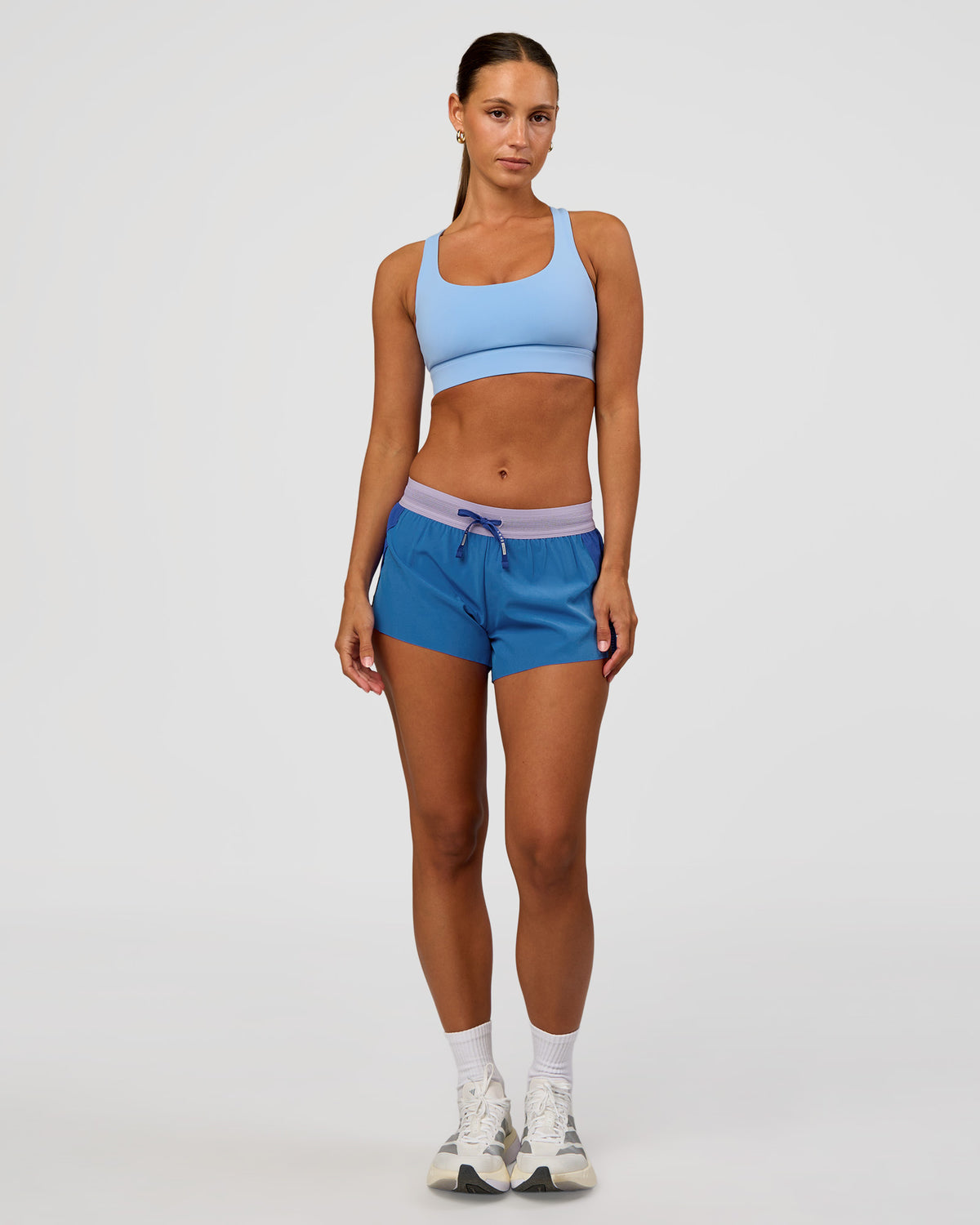 Woman wearing Accelerate 3" Mid-Rise Running Short - Electric Indigo-Multi | Model:Brylee | Size:XS