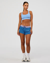 Woman wearing Accelerate 3" Mid-Rise Running Short - Electric Indigo-Multi | Model:Brylee | Size:XS | Thumbnail Index: 1