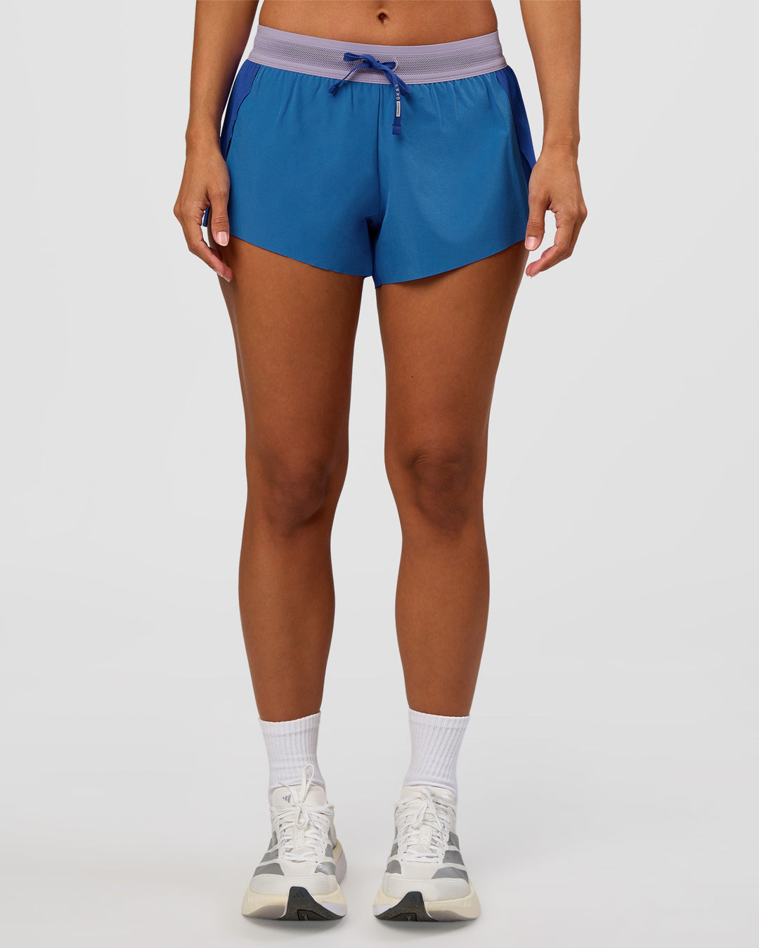 Woman wearing Accelerate 3" Mid-Rise Running Short - Electric Indigo-Multi | Set:true | Angle:front | Model:Brylee | Size:XS - view 7