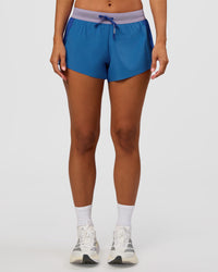 Woman wearing Accelerate 3" Mid-Rise Running Short - Electric Indigo-Multi | Set:true | Angle:front | Model:Brylee | Size:XS | Thumbnail Index: 6