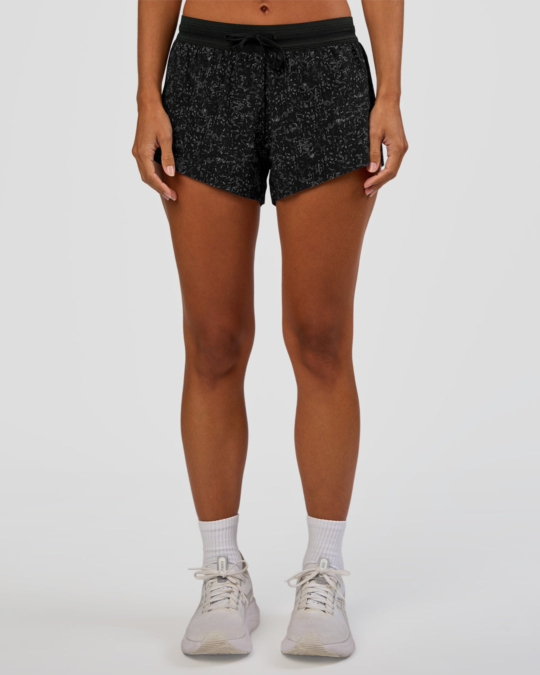 Woman wearing Accelerate 3" Mid-Rise Running Short - Energy Print Black | Set:true | Angle:front | Model:Brylee | Size:XS - view 7