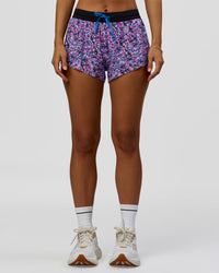 Woman wearing Accelerate 3" Mid-Rise Running Short in Energy Print Blue Multi | Model:Brylee | Size:XS | Thumbnail Index: 6
