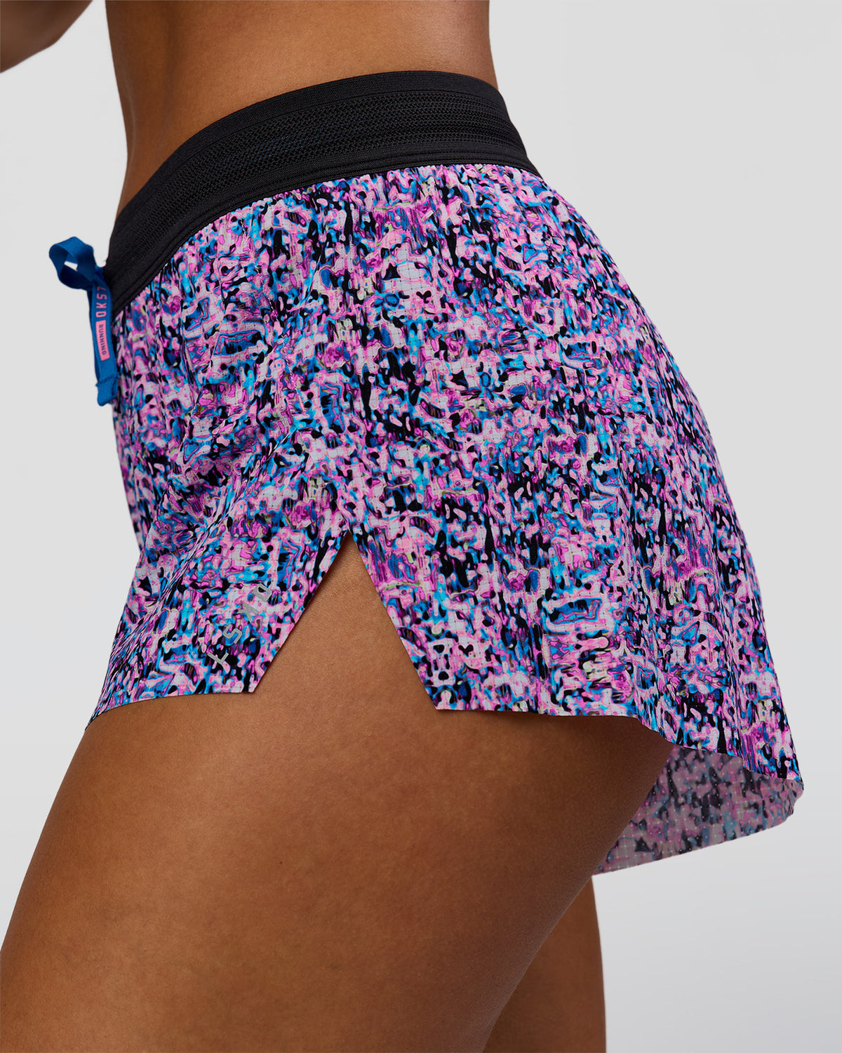 Woman wearing Accelerate 3" Mid-Rise Running Short in Energy Print Blue Multi | Model:Brylee | Size:XS