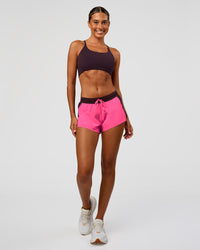 Woman wearing Accelerate 3" Mid-Rise Running Short - Midnight Plum-Sugar Plum | Model:Charli | Size:XS | Thumbnail Index: 2