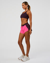 Woman wearing Accelerate 3" Mid-Rise Running Short - Midnight Plum-Sugar Plum| Model:Charli | Size:XS | Thumbnail Index: 6