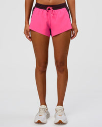 Woman wearing Accelerate 3" Mid-Rise Running Short - Midnight Plum-Sugar Plum | Set:True | Angle:front | Model:Charli | Size:XS | Thumbnail Index: 5