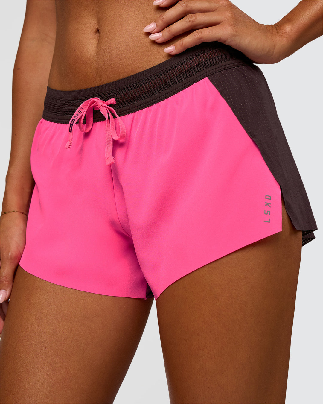Woman wearing Accelerate 3" Mid-Rise Running Short - Midnight Plum-Sugar Plum | Set:True | Angle:closeup | Model:Charli | Size:XS - view 2