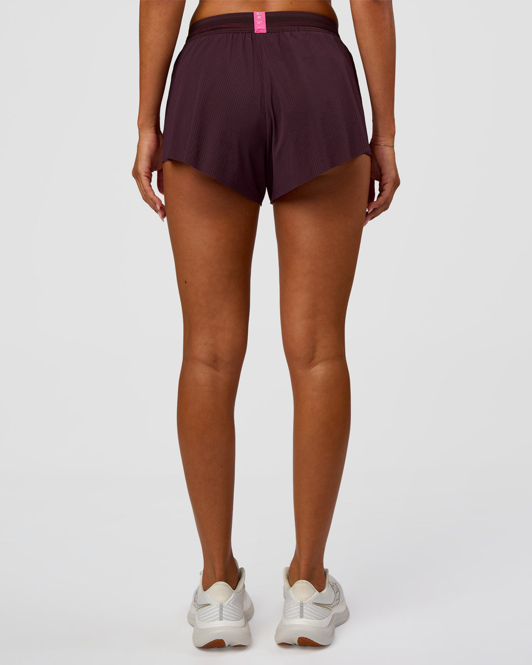 Woman wearing Accelerate 3" Mid-Rise Running Short - Midnight Plum-Sugar Plum | Set:True | Angle:back | Model:Charli | Size:XS - view 4