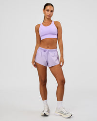Woman wearing Accelerate 3" Mid-Rise Running Short - Pale Lilac | Model:Brylee | Size:XS | Thumbnail Index: 8