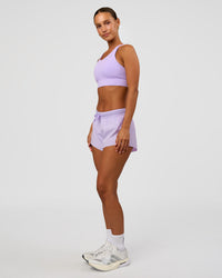 Woman wearing Accelerate 3" Mid-Rise Running Short - Pale Lilac | Model:Brylee | Size:XS | Thumbnail Index: 6