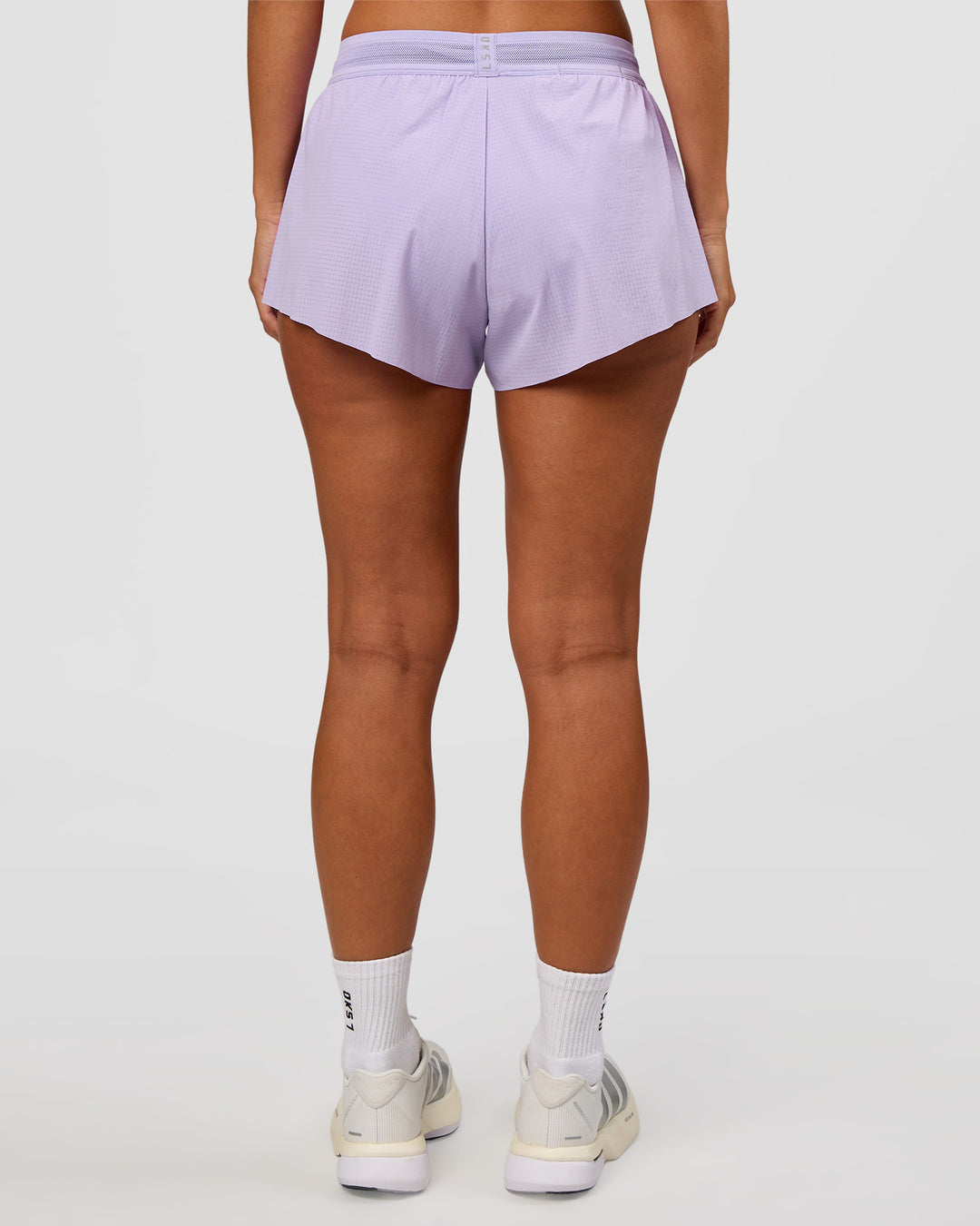 Woman wearing Accelerate 3" Mid-Rise Running Short - Pale Lilac | Set:true | Angle:back | Model:Brylee | Size:XS - view 4