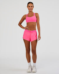 Woman wearing Accelerate 3" Mid-Rise Running Short - Sugar Plum | Model:Brylee | Size:XS | Thumbnail Index: 4
