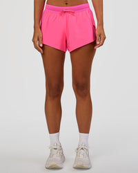 Woman wearing Accelerate 3" Mid-Rise Running Short - Sugar Plum | Set:true | Angle:front | Model:Brylee | Size:XS | Thumbnail Index: 9