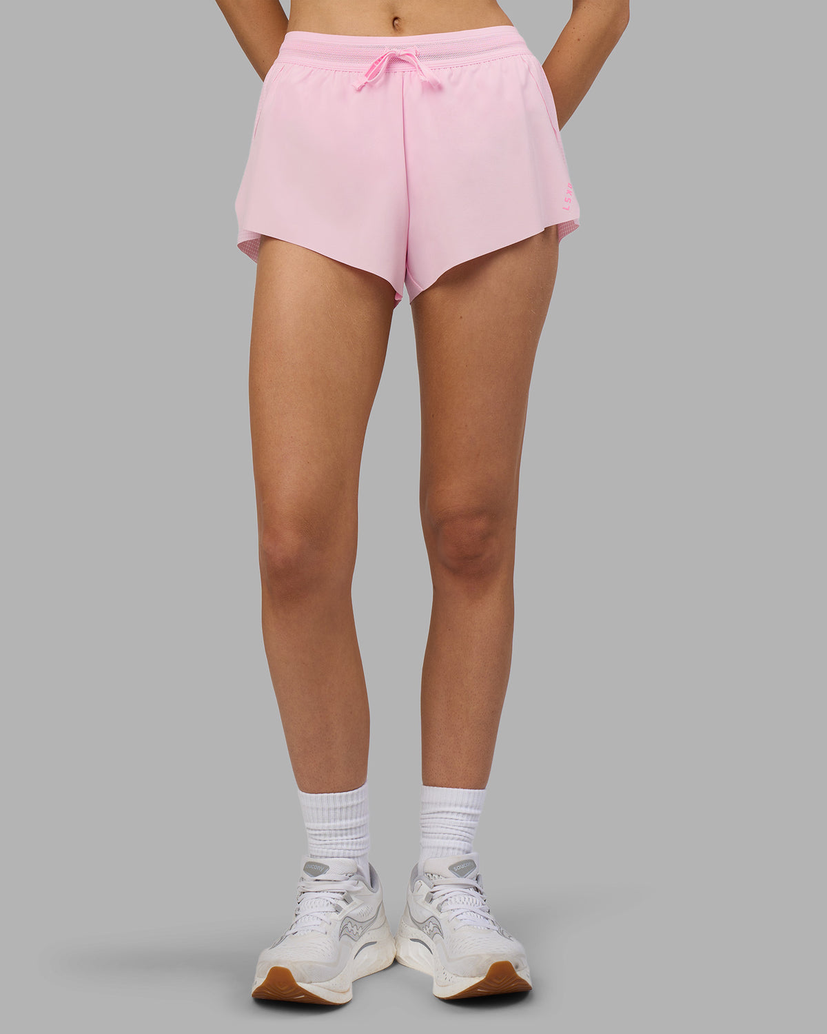 Woman wearing Accelerate 3" Running Short - Marshmallow-Candy Pink | Set:true | Angle:front | Model:Leilani | Size:XS