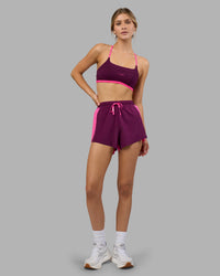Woman wearing Accelerate 3" High-Rise Running Short - Ultra Pink-Plum Caspia | Model:Leilani | Size:XS | Thumbnail Index: 1